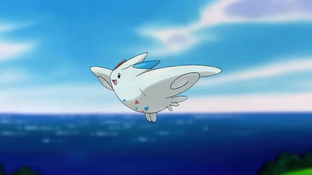 Togekiss voando em um céu azul